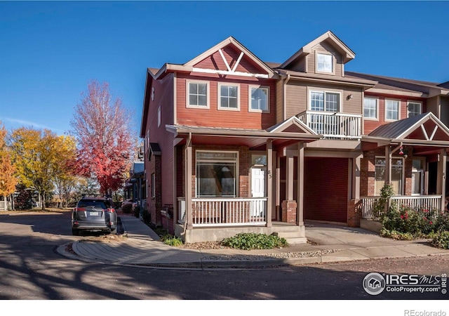818 S Terry St Unit 85, Longmont, CO 80501 - view of front of house featuring a porch and brick siding