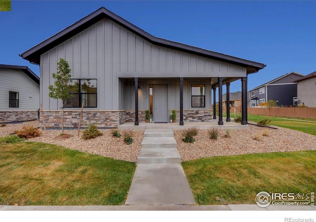 view of front of home with a front lawn and a porch