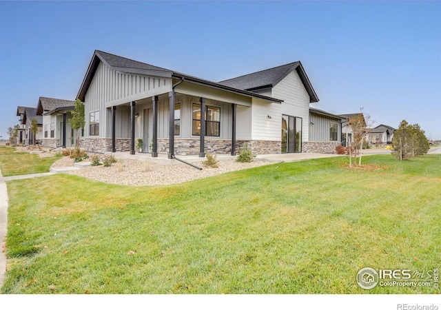 view of side of property with a lawn