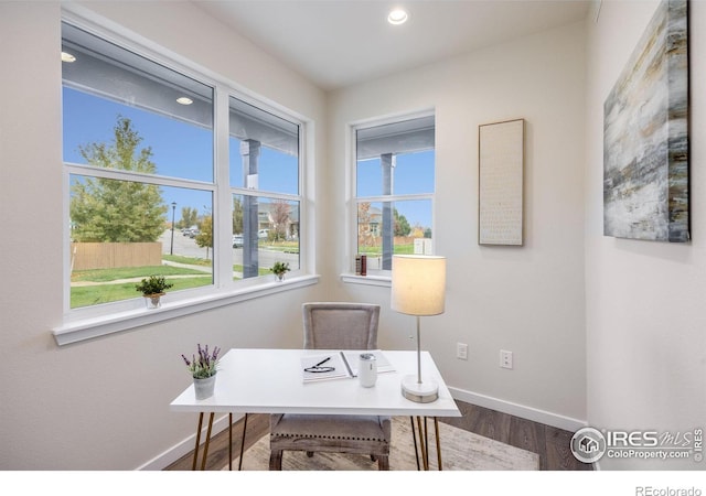 home office with hardwood / wood-style flooring