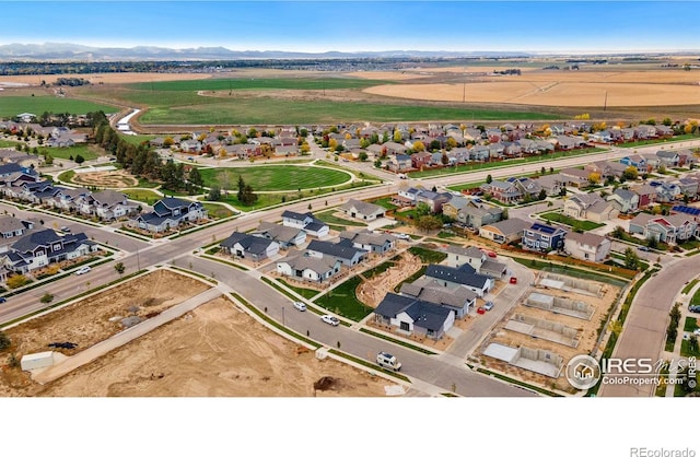 birds eye view of property featuring a mountain view