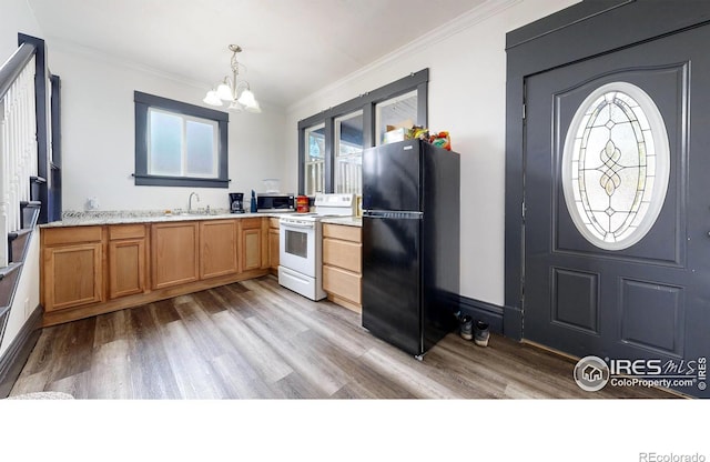 kitchen with white electric range oven, sink, black fridge, crown molding, and pendant lighting