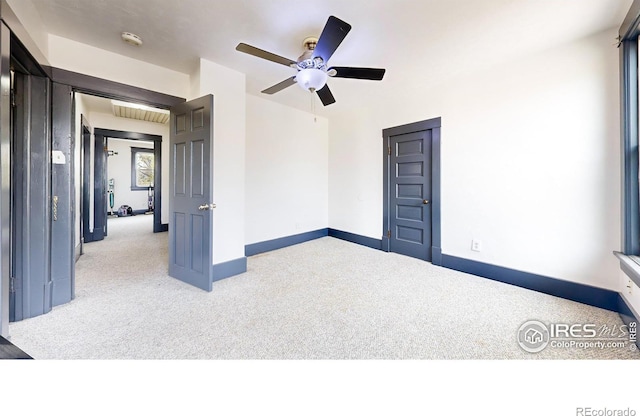 unfurnished room with light carpet and ceiling fan