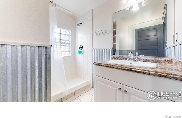 bathroom with vanity, tile patterned flooring, and a shower with shower curtain