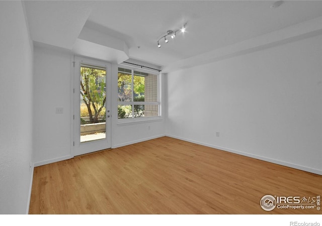 unfurnished room featuring light hardwood / wood-style flooring