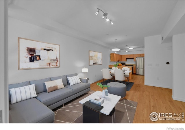 living room with light hardwood / wood-style floors