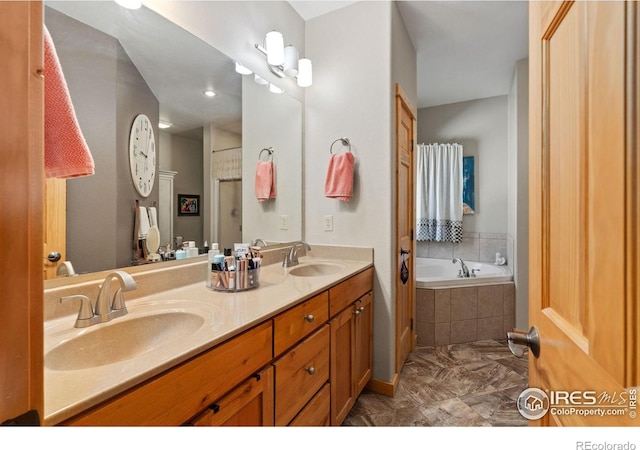 bathroom featuring vanity and separate shower and tub