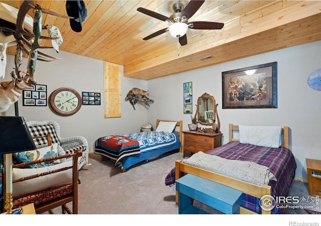 carpeted bedroom with ceiling fan and wood ceiling