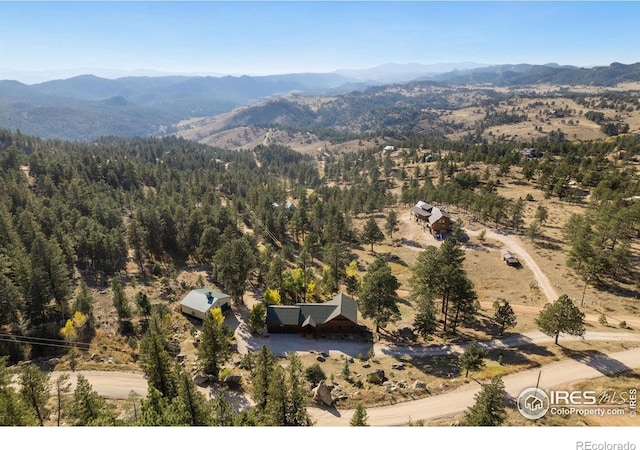 drone / aerial view featuring a mountain view