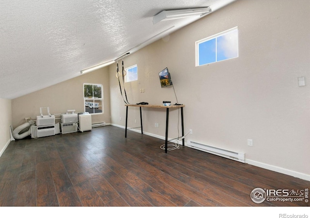 bonus room with dark wood-style flooring, a baseboard radiator, vaulted ceiling, a textured ceiling, and baseboards