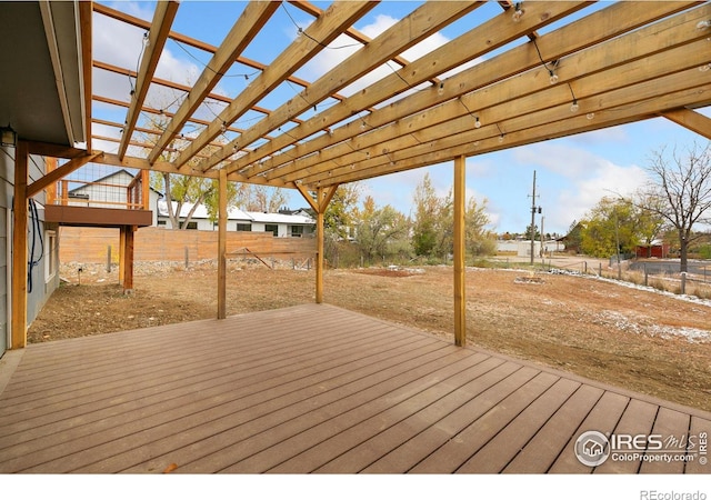 wooden deck with fence and a pergola