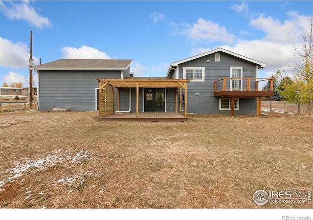 rear view of property with a wooden deck