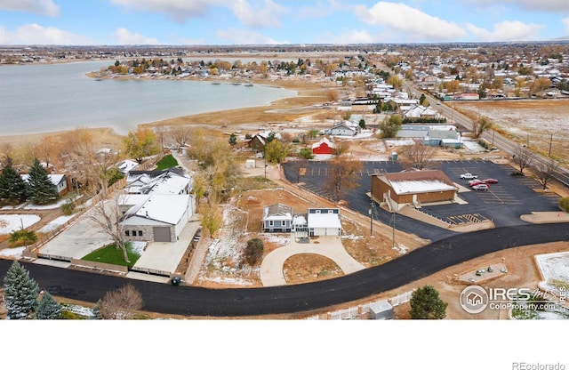 bird's eye view with a water view and a residential view