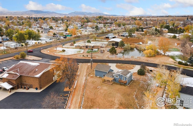 birds eye view of property with a residential view and a mountain view