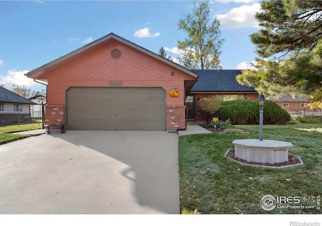 ranch-style house featuring a front yard and a garage