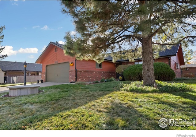 view of front facade with a garage and a front yard