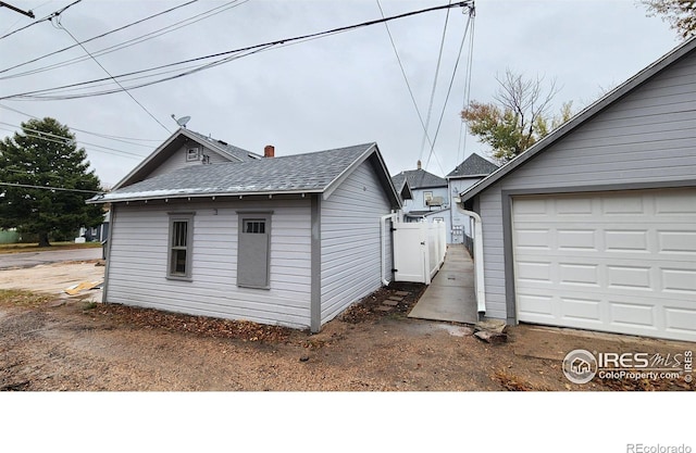 view of side of property featuring a garage