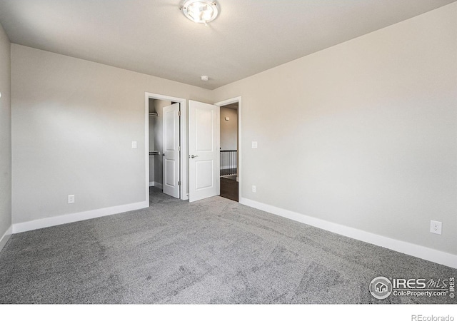 unfurnished bedroom featuring carpet