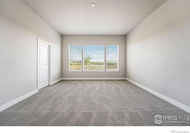 empty room with carpet flooring