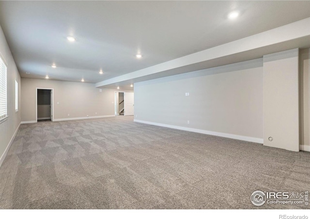 basement with light colored carpet