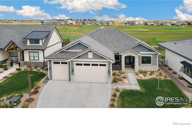 view of front of home with a garage and a front yard