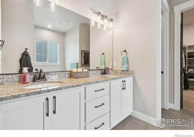 bathroom featuring vanity and tile patterned flooring