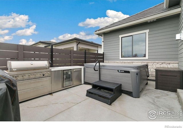 view of patio featuring a hot tub