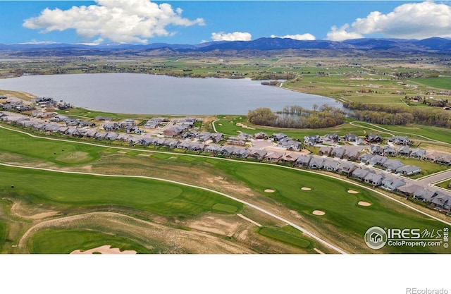 bird's eye view featuring a water and mountain view