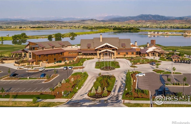 bird's eye view with a water and mountain view