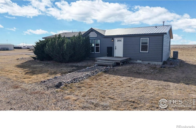 view of front of house featuring central AC