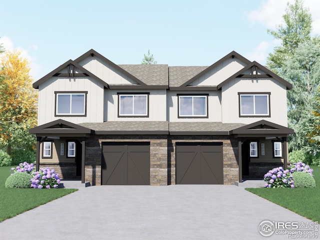 view of front of property featuring a garage and a front yard