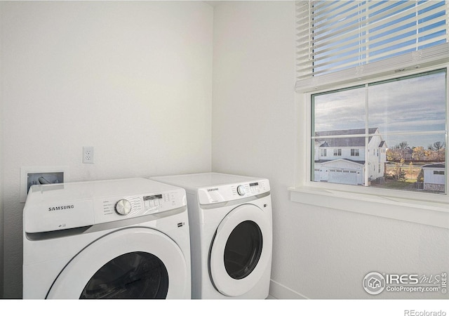 laundry room featuring washer and clothes dryer