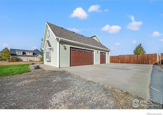 view of side of property featuring a garage