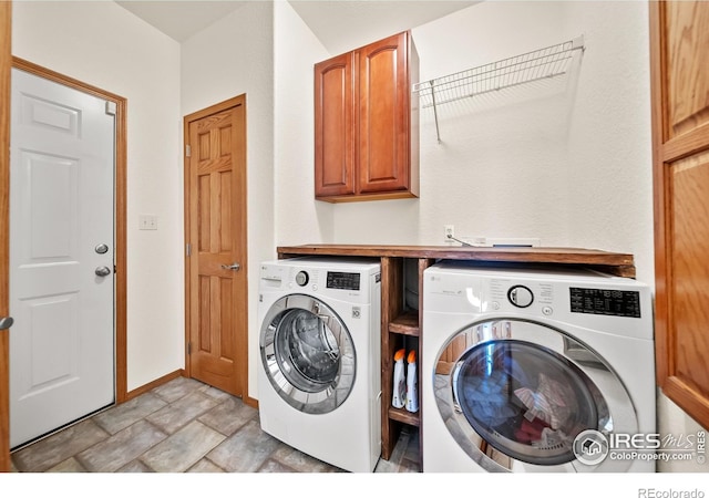 clothes washing area with cabinets and independent washer and dryer