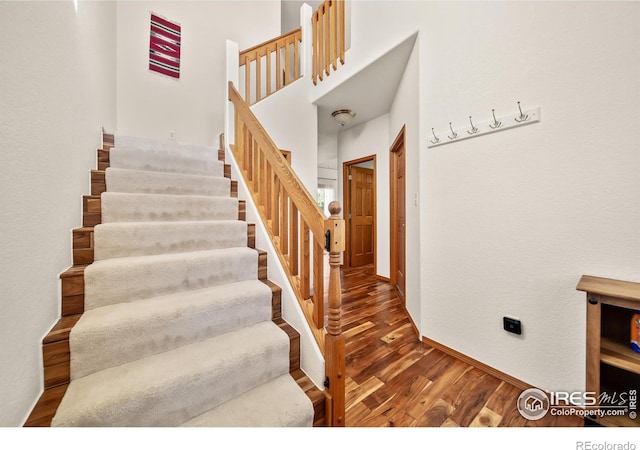 stairway featuring hardwood / wood-style floors