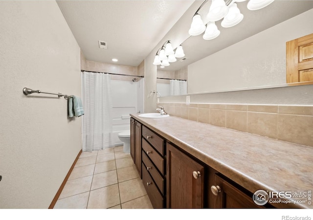 full bathroom with toilet, shower / tub combo with curtain, vanity, and tile patterned flooring