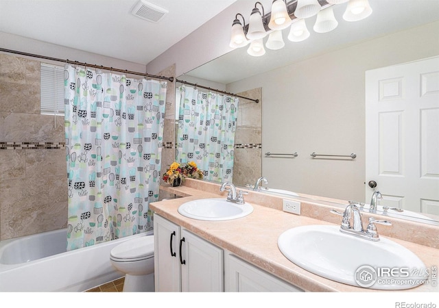 full bathroom with tile patterned floors, vanity, shower / bath combo, and toilet