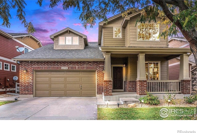 craftsman-style house featuring a garage and covered porch