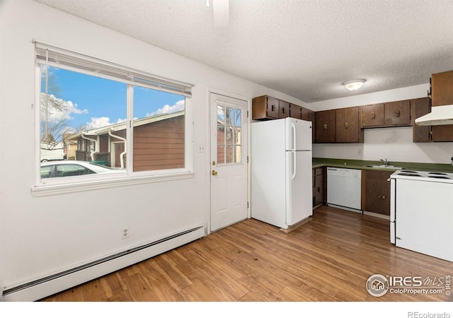 kitchen featuring a baseboard heating unit, light hardwood / wood-style floors, dark brown cabinetry, a textured ceiling, and white appliances