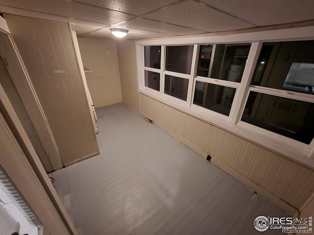 interior space with a paneled ceiling and visible vents