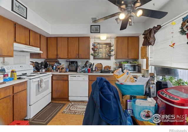 kitchen featuring white appliances, ceiling fan, and hardwood / wood-style flooring