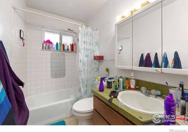 full bathroom with vanity, shower / bath combo, and toilet