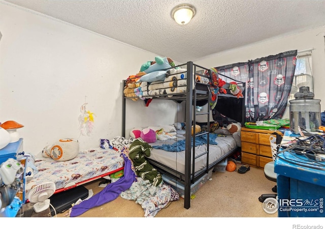 carpeted bedroom with a textured ceiling