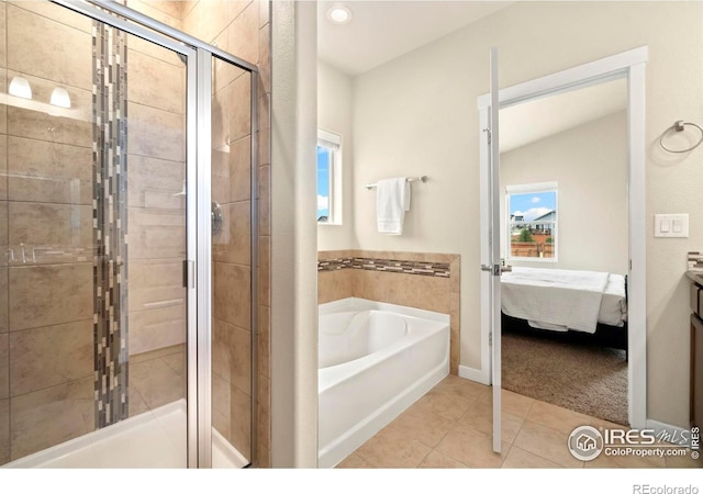 bathroom with lofted ceiling, shower with separate bathtub, and tile patterned floors