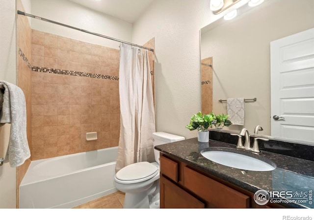 full bathroom with vanity, tile patterned floors, toilet, and shower / bath combination with curtain