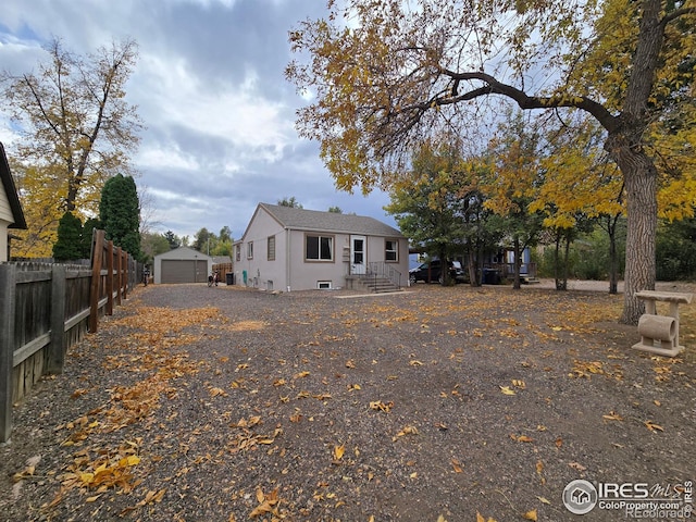 view of front of home featuring an outbuilding and a garage