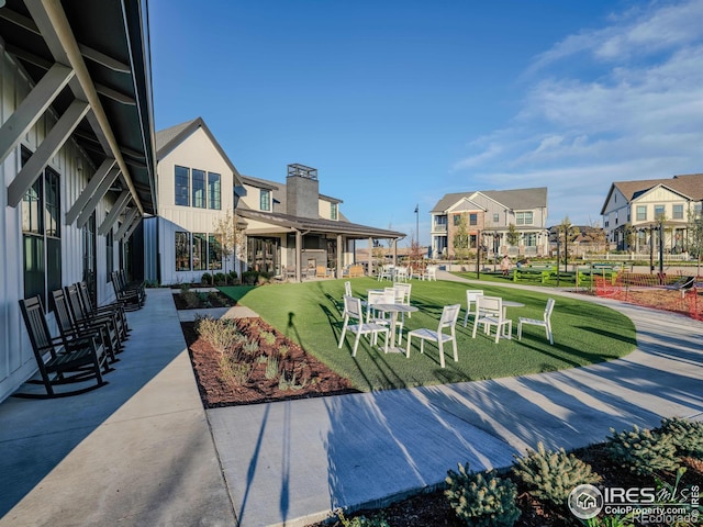 view of property's community featuring a yard