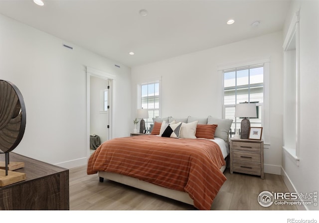 bedroom with light wood-type flooring