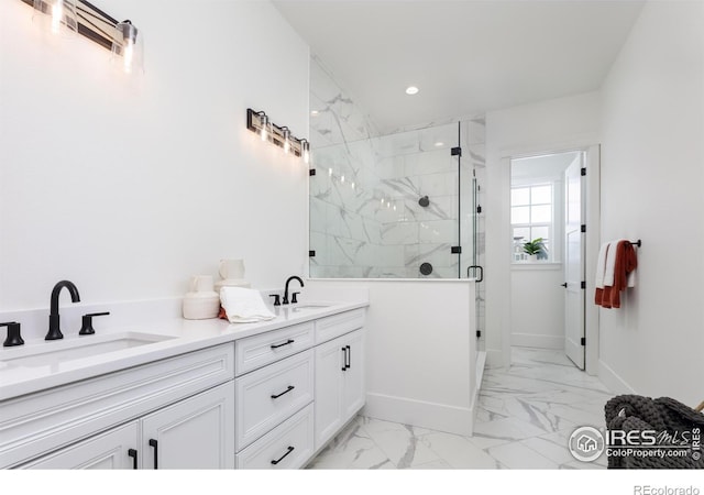 bathroom with a shower with shower door and vanity