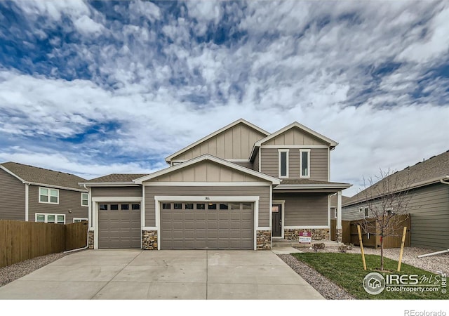 craftsman inspired home featuring a garage and covered porch